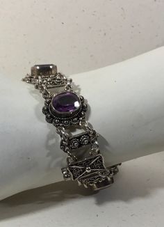 "This 6 stone sterling Silver amethyst Bracelet is 7 1/2 inches long and 5/8\" wide. Featuring 6 8x10 amethyst gemstones and a unique safety clasp." Sterling Bracelets, Amethyst Bracelet, Multi Stone Ring, Multi Stone, Amethyst Gemstone, Stone Rings, Pandora Charm Bracelet, Jewelry Rings, Amethyst