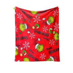 the grinch christmas blanket hanging on a wall