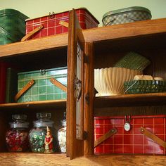 the shelves are filled with many different types of kitchen utensils and other items