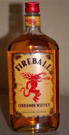 a bottle of fireball cinnamon whiskey sitting on a table