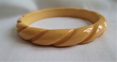 This is GORGEOUS!! Awesome Butterscotch Bakelite Bangle. The color and detail is just fabulous, on this stunning bracelet. It is in wonderful condition..This tested Positive Bakelite using semichrome.. I try to describe items to the best of my knowledge, but I never claim to be an expert. Please study the pictures carefully and feel free to ask questions. I always combine items in order to save my customers money . This will be a prize of any collection!! Email's are always welcome, and thank yo Yellow Bangle Bracelets For Formal Occasion, Retro Yellow Bangle Bracelets, Retro Yellow Bangle Bracelet, Bakelite Bangles, Victorian Gold, Vintage Cufflinks, Leather Pouch, Bangle Bracelets, Leather Bracelet