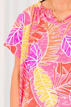 Look stylish and confident in our Make Peace Top, featuring a vibrant tropical pattern and bold colors that are perfect for the season! The ruffle detailing adds a feminine touch! Stay on trend with this must-have piece! 100% Polyester Spring Beachwear Top With Vibrant Print, Patterned Ruffle Tops For Vacation, Patterned Ruffled Tops For Vacation, Pink Summer Top With Vibrant Print, Multicolor Tops With Palm Tree Print For Spring, Tropical Patterned Tops For Summer, Pink Tropical Style Tops For Vacation, Pink Tropical Vacation Tops, Pink Tropical Tops For Vacation