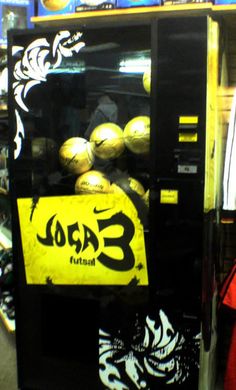 a vending machine that has some balls in it