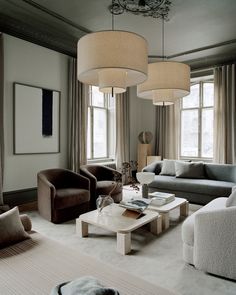 a living room filled with furniture and lamps