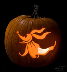 a carved pumpkin with an image of a bird on it