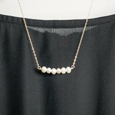 "Real pearls bar necklace, Made of real 6 pearls beads Strung on a gold filled/sterling silver wire. Perfect as a gift for your mother, as wedding gift, bride or bridesmaid. or someone else you love. ♥WANT TO MAKE IT PERSONAL? ♥ Add a charm letter to your necklace - Add this item: https://www.etsy.com/il-en/listing/687931684 ★ Comes in our signature box, ready for gift giving. ★ Available in Gold [18K goldfield chain & gold filled wire ] ★ Available in Silver [sterling silver chain & sil Elegant 14k Gold-filled Bar Necklace, Elegant 14k Gold Filled Bar Necklace, Scissor Necklace, Pearl Bar Necklace, Pearl Bridesmaid Jewelry, Real Pearl Necklace, Pearl Gifts, Pearl Necklace Wedding, Gold Bar Necklace