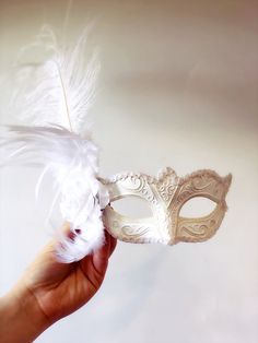 Simple and elegant, this all white mask will complement and complete your Diner en Blanc Masquerade outfit. You have the option to add white feathers, White Butterflies or both! I N C L U D E D - White mask can be purchased in white with or without the trim and glitter. - You have the option to add white feathers, white butterflies or a combination of both to your mask. Thank you for supporting small businesses and hope our products bring you and loved ones some joy and humor in these trying tim White Venetian Masks For Theater, White Venetian Masks And Prosthetics For Theater, Venetian White Mask For Theater, White Venetian Mask For Costume Party, Venetian White Mask For Costume Party, White Venetian Mask For Costume, White Eye Mask For Costume Party, White Venetian Mask, White Masquerade Masks For Carnival