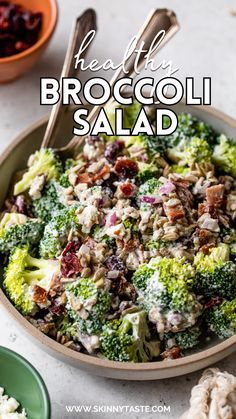 broccoli salad in a bowl with spoons on the side