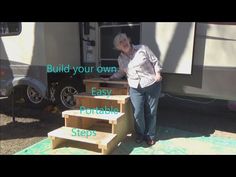 an older woman standing in front of a trailer with steps leading up to the door