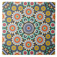 an intricate pattern with many colors and shapes in the center, on a white background