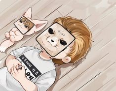 a boy laying on the floor with two cell phones in front of his face as if they were hiding behind him