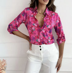 The Sophie Floral Print Blouse adds a touch of femininity and elegance to your wardrobe with its charming floral pattern. Crafted from soft, breathable fabric, this blouse offers a comfortable fit while the delicate print enhances its timeless appeal. The versatile design makes it perfect for both casual outings and more polished occasions. With the Sophie Floral Print Blouse, you can effortlessly elevate any look with a splash of floral sophistication. Winter Blouses, Hot Pink Floral, Spring Blouses, Roll Up Sleeves, Floral Print Blouses, Fashion Mode, Casual Blouse, Casual Look, Look Chic