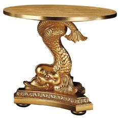 a gold table with a fish on it