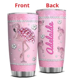 two pink flamingos are standing next to each other and the words welcome on them