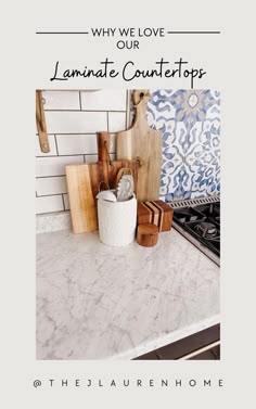 a counter top with cutting boards and utensils on it in front of a white tile backsplash