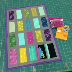 the quilt is laying on top of the cutting mat