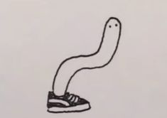 a black and white drawing of a shoe with a worm on it's side