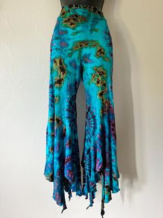 Free shipping!  Tie dye flare leg culottes pants. Super Stretchy and easy to move and dance in. One size fits S-L   Colors may vary depending on flash on camera ◡̈ Hippie Wide Leg Flares For Spring, Hippie Wide Leg Spring Flares, Spring Hippie Wide Leg Flares, Hippie Stretch Bottoms For Festival, Summer Hippie Wide Leg Flares, Hippie Wide Leg Flares For Summer, Hippie Wide Leg Summer Flares, Hippie Style Wide Leg Summer Flares, Stretch Summer Bottoms With Wide Hem