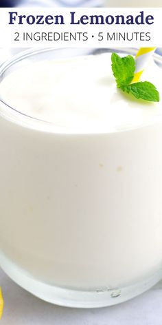 a close up of a bowl of yogurt on a table with lemons