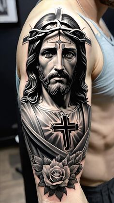 a man with a cross and roses on his arm