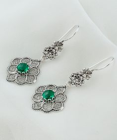 Emerald Silver Boho Floral Dangle Earrings, 925 Sterling Silver Green Gemstone Artisan Handmade Filigree Flower Women Drop Earrings Handmade Jewelry, anniversary gift her, birthday gift her, silver gift for her, dreamy floral dangle Material: 925 Sterling Silver (NICKEL FREE) Length & Width: 5.5 cm X 2 cm // 2.1 Inches X 0.8 Inches Gemstone: Emerald Quartz 6mm. FREE, FAST AND TRACKABLE SHIPPING FOR ALL EU COUNTRIES AND USA. COMES WİTH VELVET POUCH AND LUXURY GİFT BOX. Step into a world of elegance and nature with our Emerald Silver Boho Floral Dangle Earrings. Handcrafted with love and attention to detail, these exquisite earrings are the epitome of artisan beauty. The vibrant green emerald gemstones capture the essence of nature's brilliance, while the intricate filigree flower design add Elegant Green Flower Earrings Nickel Free, Green Sterling Silver Flower-shaped Earrings, Green Sterling Silver Dangle Flower Earrings, Green Sterling Silver Flower Drop Earrings, Emerald Quartz, Boho Drop Earrings, Flower Women, Red Quartz, Stylish Earrings