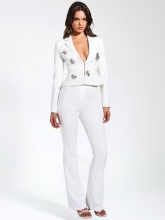 Elevate your style with our Waleria White Stretch Crepe Flare Pants. Made from woven stretch crepe with medium stretch, they offer comfort and sophistication. The flattering flare silhouette elongates the legs and adds glamor to any outfit. Pair them with our Wilda White Crystal Embellished Blazer for a coordinated look or style them separately for versatility. Whether for a formal event or a casual outing, these pants will elevate your ensemble effortlessly. Paired harmoniously with the Wilda P Elegant Stretch Pantsuit For Spring, Chic Fitted Ankle-length Pantsuit, Chic Ankle-length Evening Pantsuit, Chic Fitted Wide Leg Pants For Evening, Fall Chic Stretch Pantsuit, Chic Wide Leg Elastane Pants For Spring, Chic Wide Leg Elastane Pants For Party, Elegant Fitted Dress Pants For Spring, Elegant Elastane Pants For Party