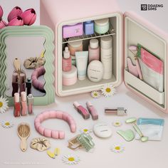 an open pink box containing cosmetics and other items