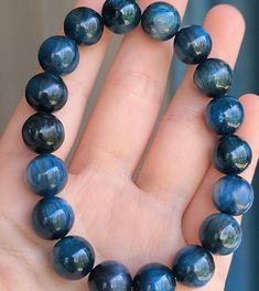 Material:Natural Kyanite beads size :  12  mm   quantity: one strand 6mm approx 29 pcs one strands 7mm approx25 pcs one strands 8mm approx 22 pcs one strands 9mm approx 21pcs one strands 10mm approx 19 pcs one strands 11mm approx 18pcs one strands 12mm approx 16 pcs one strands 13mm approx 16 pcs one strands 14mm approx 15 pcs one strands 15mm approx 14pcs one strands 16mm approx 14 pcs one strands 17mm approx 13pcs one strands 18mm approx 13pcs one strands 19mm approx 12pcs one strands 20mm approx 12pcs one strands PLEASE NOTE: 1.Due to lighting effects, monitor's brightness/contrast settings etc, there could be some slight differences in the color tone of the pictures and the actual item. 2.Each piece of natural crystal is unique, the imperfections add natural characters to them. There m Sapphire Beaded Bracelets For Gifting, Sapphire Beaded Bracelets As Gift, Sapphire Beaded Bracelets For Gift, Handmade Sapphire Color Bracelets With Round Beads, Bracelet For Friends, Kyanite Bracelet, Blue Kyanite, Bracelets Handmade Beaded, Handmade Beads