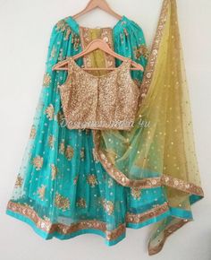 Turquoise lehenga blouse with yellow dupatta custom stitched. Plus size available at a small up-charge. Size: This is custom made outfit as per your size. Post your order we will send you a measurements reference sheet using which you can provide details required to make your outfit with best fit. Fabric and work: Lehenga - Embroidered Net fabric. Blouse - Heavy embroidered sequences net fabric. Dupatta - SDupatta is in Net with embroidery lace border on all sides of it. Dupatta is decorated wit Designer Turquoise Lehenga With Dupatta, Semi-stitched Turquoise Lehenga For Festivals, Turquoise Semi-stitched Lehenga For Festivals, Semi-stitched Turquoise Lehenga With Zari Work, Turquoise Semi-stitched Lehenga With Pallu, Turquoise Designer Lehenga For Navratri, Semi-stitched Turquoise Lehenga With Pallu, Designer Wear Turquoise Lehenga For Navratri, Designer Turquoise Lehenga With Pallu