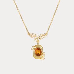 This Osmanthus Fragrans Pendant Necklace is an luxuriously exquisite piece. Handcrafted with beautiful enamel, it is an elegant accessory that will instantly upgrade any formal look. A timeless treasure, it is sure to become a cherished heirloom. DETAILS Plating: 18K Gold Materials: 18K Gold on Brass, Enamel, Artificial Gemstone Measurements: Length: 16.53"(42cm) + Extender: 2.56"(6.5cm) Weight: 13.7g Hypoallergenic design Exquisite Oval Pendant Necklace As Gift, Exquisite Oval Pendant Necklace Gift, Gold Flower-shaped Gemstone Jewelry, Gold Flower Gemstone Jewelry, Gold Flower Shaped Jewelry With Gemstone, Gold Pendant Flower Necklace With Clavicle Chain, Gold Gemstone Necklaces With Flower Design, Gold Pendant Flower Necklace, Luxury Amber Necklace For Anniversary