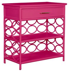 a pink shelf with two shelves on each side and circles painted on the bottom, in front of a white background