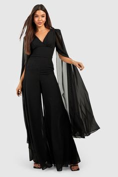 Womens Cape Detail Plunge Wide Leg Jumpsuit - Black - 8 - Take the plunge with this v neck jumpsuit from our latest collection. An all-in-one bust-accentuating piece that features a plunging v neckline, this style is sitting pretty at the top of our wish list this season. Step out of your comfort zone and pair a deep v neck jumpsuit with your fave heels and slicked back hair. Wanna make a statement? Choose a black v neck jumpsuit for maximum impact and get ready to bring new energy.Style: Wide L Womens Cape, Tuxedo Jumpsuit, V Neck Jumpsuit, Out Of Your Comfort Zone, Designer Jumpsuits, Slicked Back Hair, Capes For Women, Sitting Pretty, Cape Sleeves