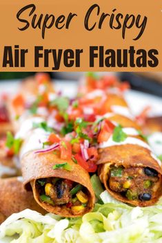 an air fryer fajita cut in half on a plate with lettuce and tomatoes