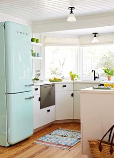 an image of a kitchen setting with refrigerator and dishwasher in the corner,