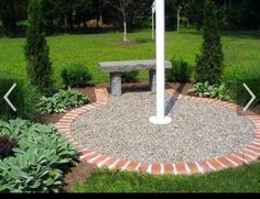 a stone bench sitting in the middle of a garden