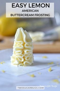 a lemon buttercream frosting recipe on a cutting board with the words easy lemon buttercream frosting