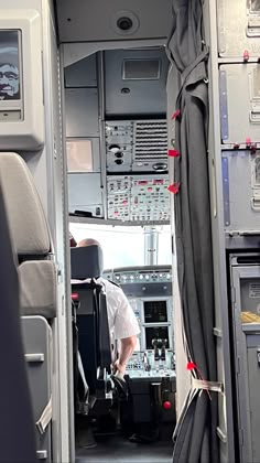 the inside of an airplane with two pilots