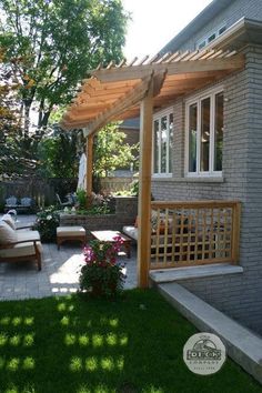 an outdoor patio with seating and pergolated area