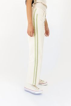 the perfect straight leg pants for your y2k-inspired outfit, these off-white bottoms feature trendy sage green stripe details. you can play up the pop of color or let them make a statement on their own. either way, these carpenter-inspired bottoms are on-trend + should be on you. beige + green stripes // straight leg, one button zip fly, belt loops, pockets paired with our stranger mock neck tank model is 5'10" + wearing a small measurements are approximate + taken while laying flat small : wais Wide Leg Cotton Bottoms With Vertical Stripes, Spring Cotton Bottoms With Striped Hem, Wide Leg Cotton Pants With Contrast Stripes, Straight Pants With Contrast Stripes For Spring, Casual Straight Leg Bottoms With Contrast Stripes, Spring Bottoms With Contrast Stripes And Straight Leg, Spring Contrast Stripes Cotton Bottoms, Cotton Bottoms With Contrast Stripes For Spring, Cotton Bottoms With Side Stripes For Spring