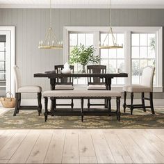 the dining room table is set with six chairs and two benches, along with an area rug on the floor