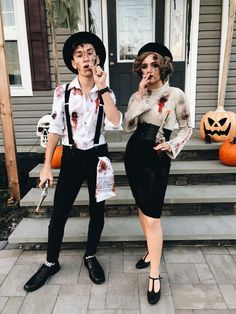 two people dressed up as zombies for halloween