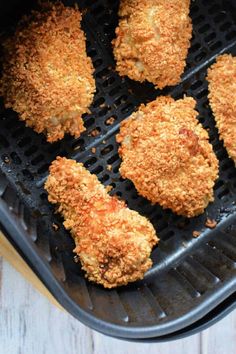 fried chicken is cooking in an air fryer