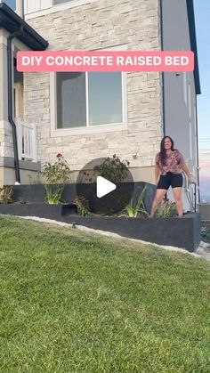 a woman standing in front of a house with the words diy concrete raised bed