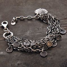 "charms layered multi strand chain bracelet handmade of oxidized 925 sterling silver, signed, © ewa lompe APPROXIMATE MEASUREMENTS: total length: 18 -21.5 cm + 4 cm adjustable chain or 7 -8.5\"+ 1.6\" adjustable chain handmade raw charms size ( 12 pics): 5-7 mm bigger charm size: 17 mm lobster clasp: 16 mm Layering pieces combine to form one gorgeous sterling silver layered chains bracelet. Nineten sweeping multi strand chains made from high quality 925 silver flow around the wrist in a beautifu Bohemian Oxidized Chain Bracelet Gift, Bohemian Oxidized Chain Bracelet, Bohemian Sterling Silver Bracelet With Oxidized Finish, Jewelry Queen, Sequin Bracelet, Multi Chain Bracelet, Art Jewelry Design, Carnelian Bracelet, Silver Ring Designs