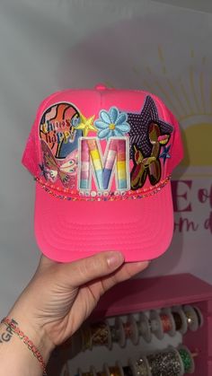 Have you been wanting one of those popular custom trucker hats? Want your hat to be made in a video and posted on TikTok? Well look no further!  Price includes up to 5 patches. Any additional patches are priced by size. Please message the seller for pricing sheet!  Chains are additional cost, please be sure to add them if they are wanted! Adjustable Trucker Snapback Hat With Patches, Adjustable Pink Trucker Hat With Patches, Adjustable Snapback Trucker Hat With Patches, Pink Cap With Patches, Customizable Pink Snapback Hat With Curved Brim, Customizable Multicolor Snapback Baseball Cap, Fun Embroidered Trucker Hat Baseball Cap, Fun Embroidered Trucker Baseball Cap, Trendy Customizable Pink Baseball Cap