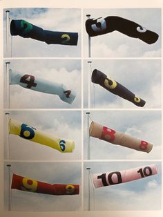 four different colored umbrellas in the sky with numbers and symbols on them, all hanging upside down