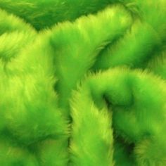 bright green furry material is shown in close up