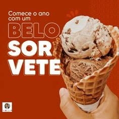 a hand holding an ice cream cone with chocolate chunks in it and the words, come o'am belo sor vete