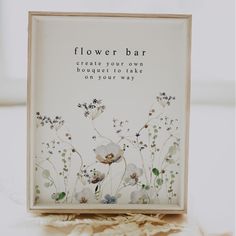 a flower bar sign sitting on top of a table