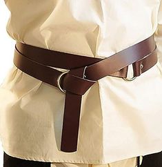 a person wearing a white shirt and brown belt